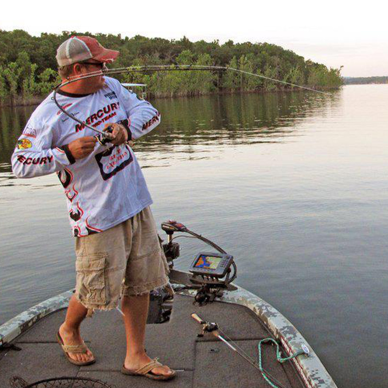 James Watson hooking a fish
