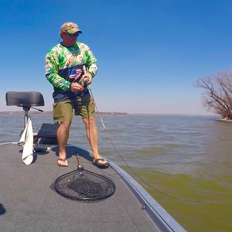 Troy and friend netting a fish